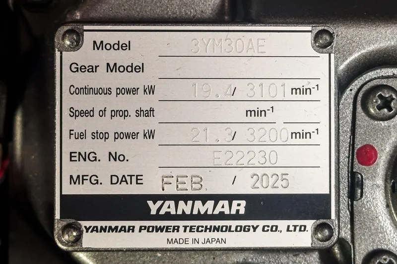 Slide: The Image of Yanmar engine plate, model 3YM30AE, manufactured February 2025, for Hunter 33, 2015. - 26