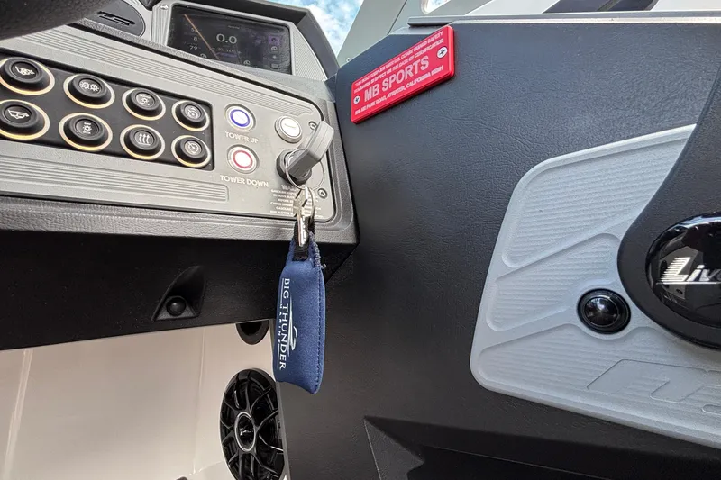 Slide: The Image of Control panel of MB B52 23 Alpha boat, 2026 model, with key and buttons. - 13