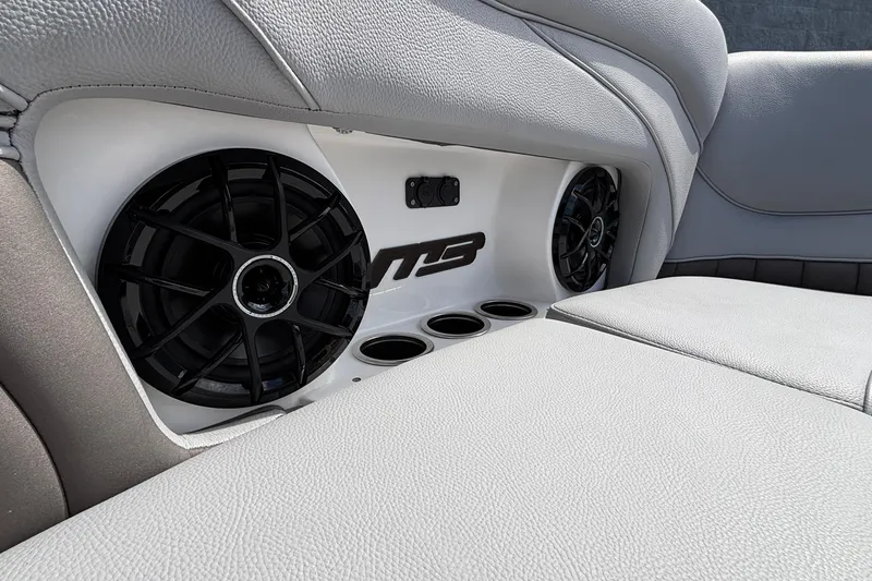 Slide: The Image of Interior of 2026 MB B52 23 Alpha with speakers and cup holders. - 15