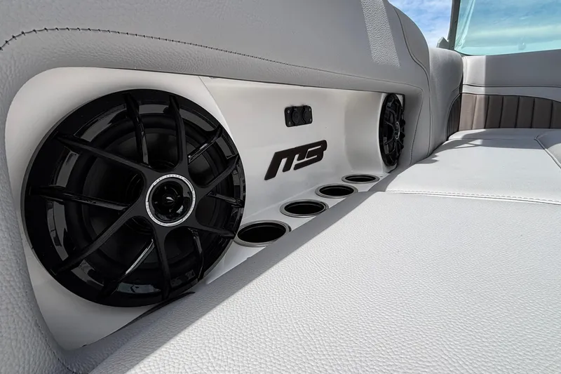 Slide: The Image of Interior of 2026 MB B52 23 Alpha boat with speakers and cup holders. - 16