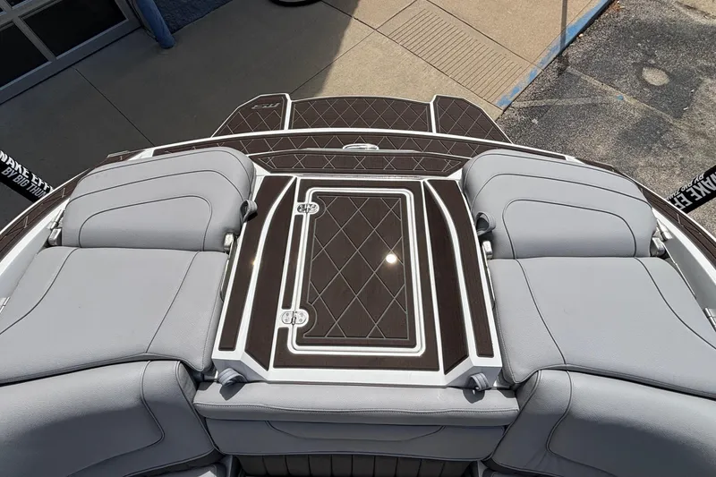 Slide: The Image of 2026 MB B52 23 Alpha boat interior with sleek gray seating and elegant deck design. - 17