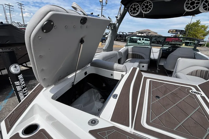 Slide: The Image of 2026 MB B52 23 Alpha boat interior with open storage compartment and seating. - 21