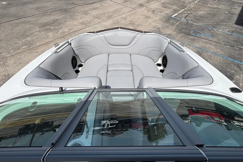 Slide: The Image of 2026 MB B52 23 Alpha boat interior with gray seating and speakers. - 27