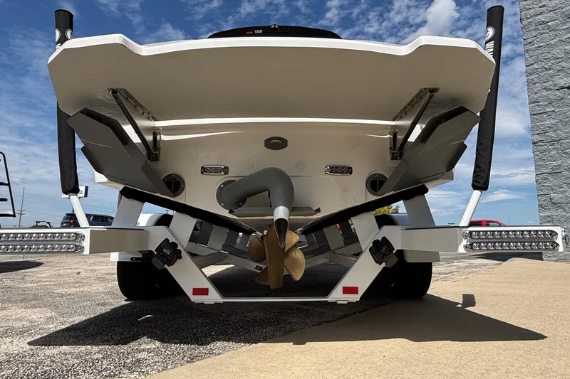 Slide: The Image of Rear view of 2026 MB B52 23 Alpha boat on trailer under blue sky. - 3