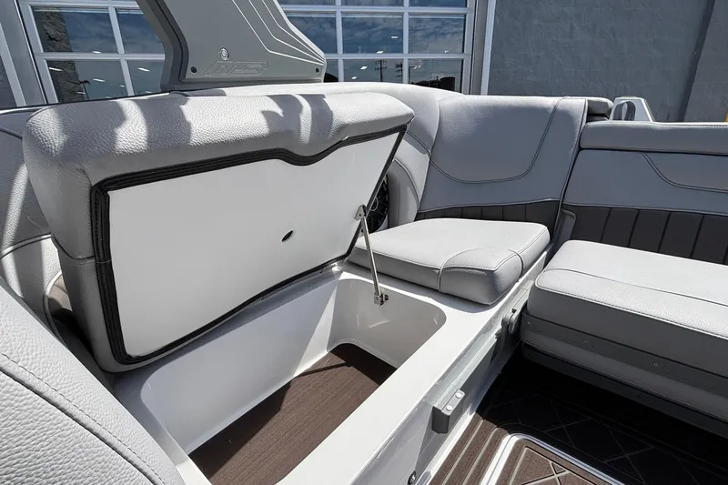 Slide: The Image of Open storage compartment in 2026 MB B52 23 Alpha boat with gray seating. - 33