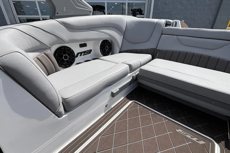 Slide: The Image of Luxurious interior of 2026 MB B52 23 Alpha boat with plush seating and speakers. - 5