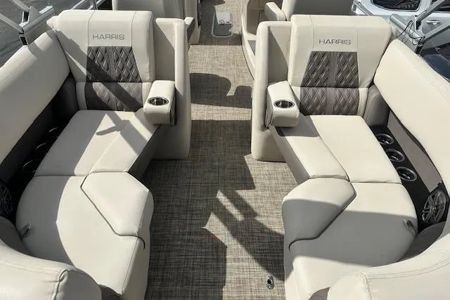 Slide: The Image of 2020 Harris Solstice 250 boat interior with beige seating and cup holders. - 12