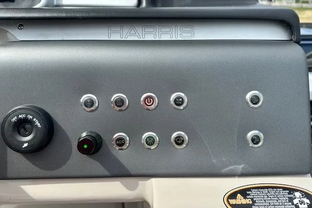 Slide: The Image of Control panel of 2020 Harris Solstice 250 boat with various switches and buttons. - 18