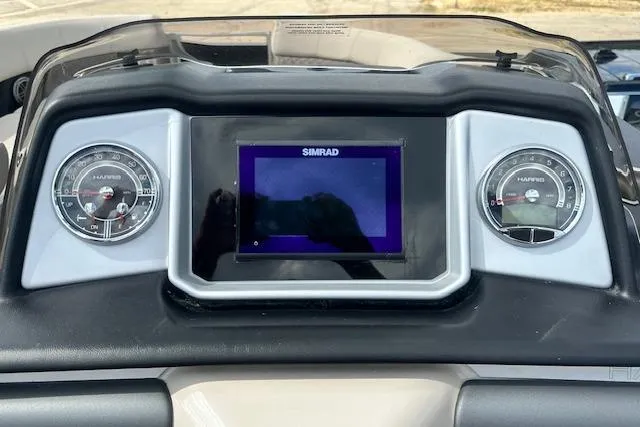 Slide: The Image of Dashboard of 2020 Harris Solstice 250 boat with Simrad display and gauges. - 21