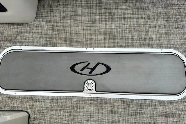 Slide: The Image of 2020 Harris Solstice 250 boat deck with logo on textured surface. - 26