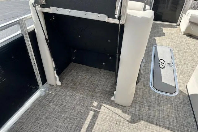 Slide: The Image of 2020 Harris Solstice 250 boat interior with beige seating and textured flooring. - 34