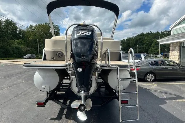 Slide: The Image of 2020 Harris Solstice 250 boat with 350 horsepower engine, parked outdoors. - 5