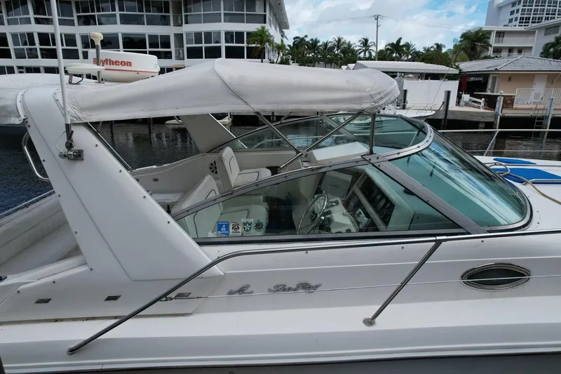 Slide: The Image of Engine compartment of a 1994 Sea Ray 370 Express Cruiser with visible wiring and hoses. - 51