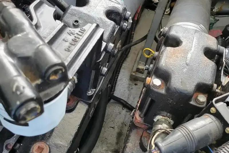 Slide: The Image of Engine components of a 1994 Sea Ray 370 Express Cruiser boat. - 54