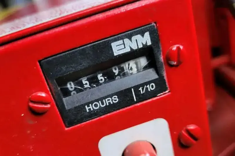 Slide: The Image of Hour meter on 1994 Sea Ray 370 Express Cruiser, showing 559.4 hours. - 56