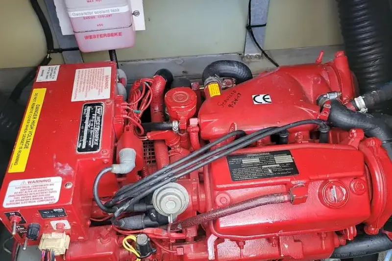 Slide: The Image of Engine compartment of a 1994 Sea Ray 370 Express Cruiser with Westerbeke generator. - 57