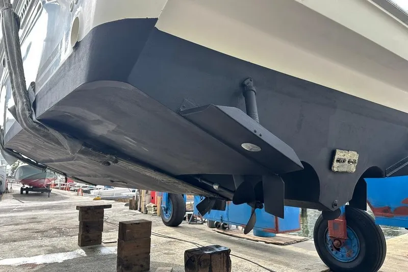 Slide: The Image of 1994 Sea Ray 370 Express Cruiser on dry dock, showing hull and propeller details. - 8