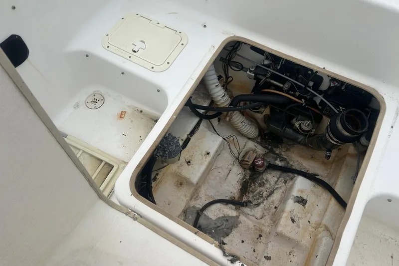 Slide: The Image of Open engine compartment of a 2001 Sea Fox 204 Millenium boat, showing internal components. - 14