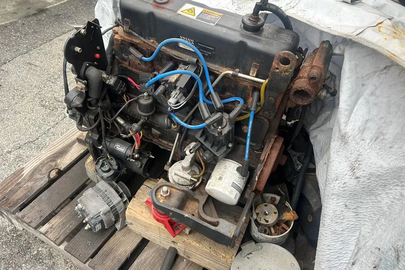 Slide: The Image of Rusty engine on a wooden pallet, possibly from a 2001 Sea Fox 204 Millenium boat. - 16