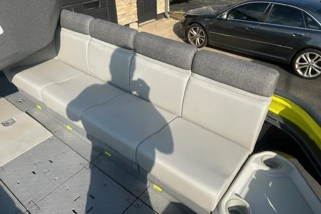 Slide: The Image of 2023 Sea Doo Switch interior seating with gray upholstery and modern design. - 11