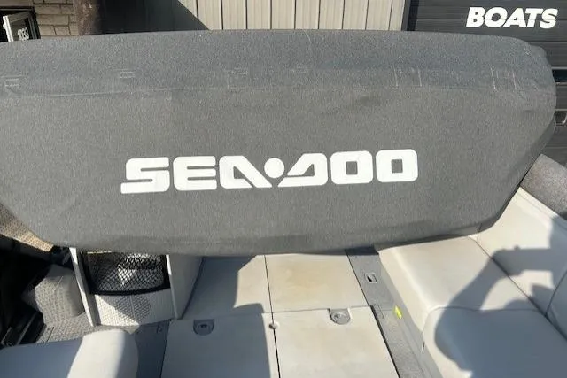 Slide: The Image of 2023 Sea Doo Switch boat interior with branded seat cover, showcasing modern design. - 12