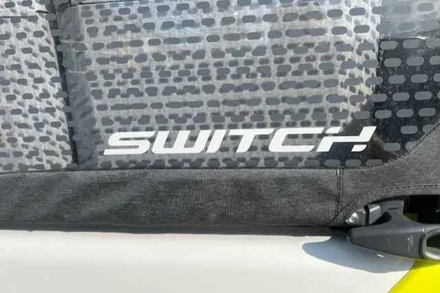 Slide: The Image of 2023 Sea Doo Switch seat detail with patterned upholstery and logo. - 15