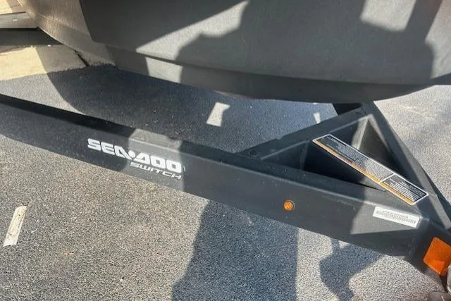 Slide: The Image of 2023 Sea Doo Switch trailer hitch on asphalt, showcasing brand logo. - 3