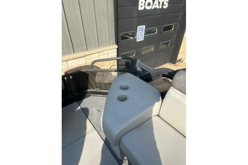 Slide: The Image of 2023 Sea Doo Switch boat interior with cup holders and seating. - 6