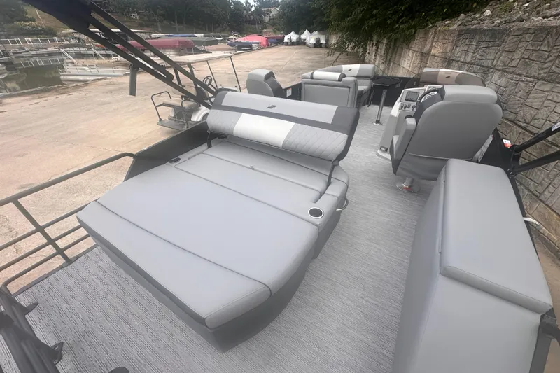 Slide: The Image of 2026 Starcraft EXS 3 Q DH boat interior with gray seating and modern design. - 12