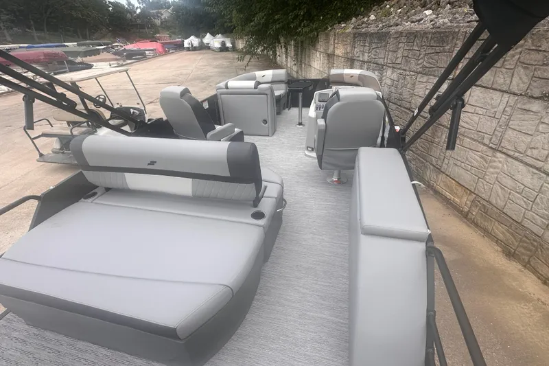 Slide: The Image of 2026 Starcraft EXS 3 Q DH boat interior with gray seating and modern design. - 14