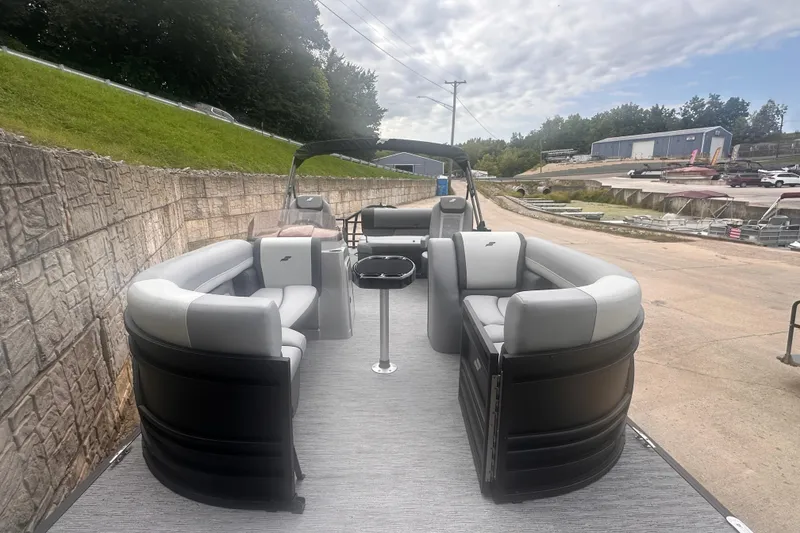 Slide: The Image of 2026 Starcraft EXS 3 Q DH pontoon boat with spacious seating and modern design. - 3