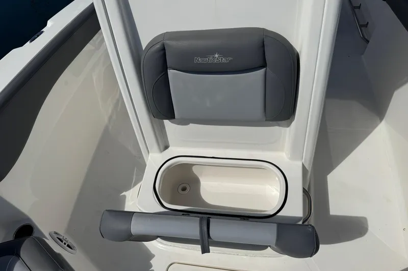 Slide: The Image of 2023 NauticStar 242L Offshore boat seat with storage compartment. - 34