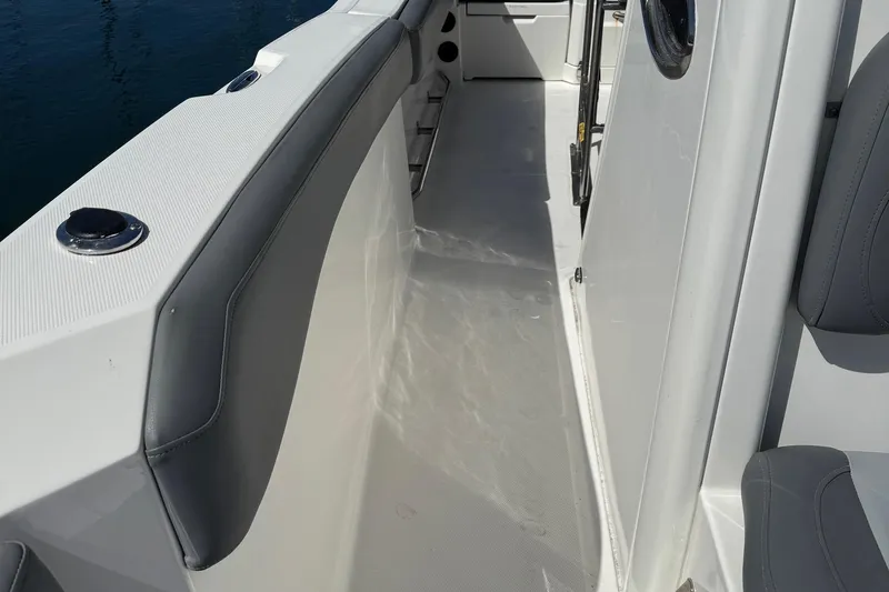 Slide: The Image of 2023 NauticStar 242L Offshore boat interior with sleek seating and modern design. - 35