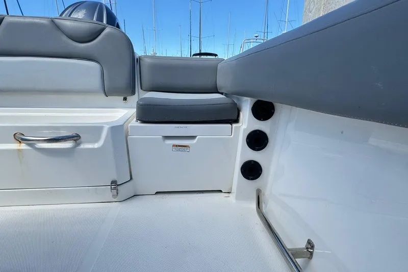 Slide: The Image of 2023 NauticStar 242L Offshore boat interior with seating and storage compartments. - 41