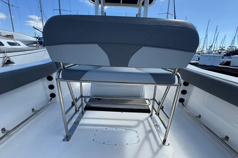 Slide: The Image of 2023 NauticStar 242L Offshore boat interior with seating and stainless steel frame. - 45
