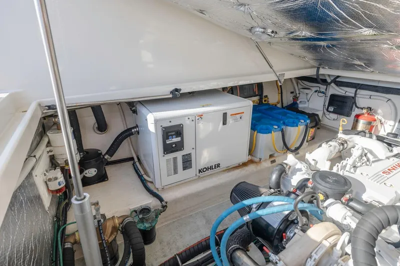 Slide: The Image of Engine room of 2008 Back Cove 33 boat with Kohler generator and equipment. - 27