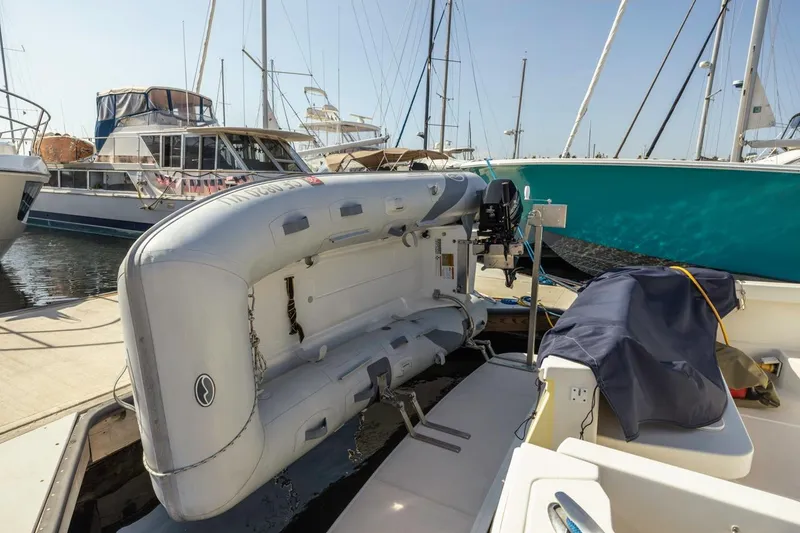 Slide: The Image of 2008 Back Cove 33 boat in dry dock, hull view, surrounded by other vessels. - 28