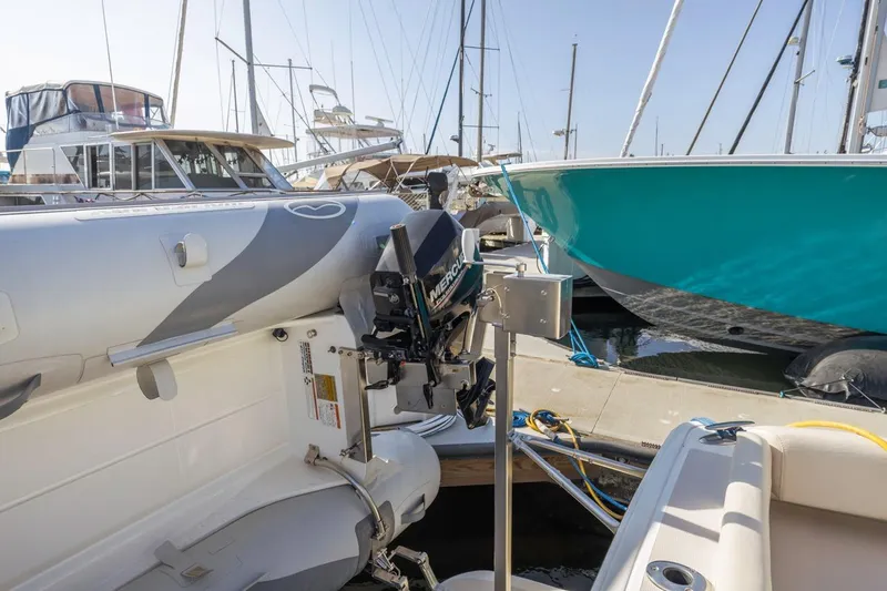 Slide: The Image of 2008 Back Cove 33 yacht docked with inflatable boat and outboard motor. - 31