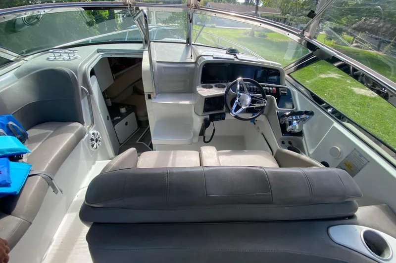 Slide: The Image of 2005 Formula 280 Sun Sport boat interior with steering wheel and seating area. - 30