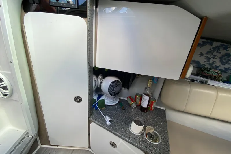 Slide: The Image of Interior of 2005 Formula 280 Sun Sport boat with cabinets and countertop items. - 40