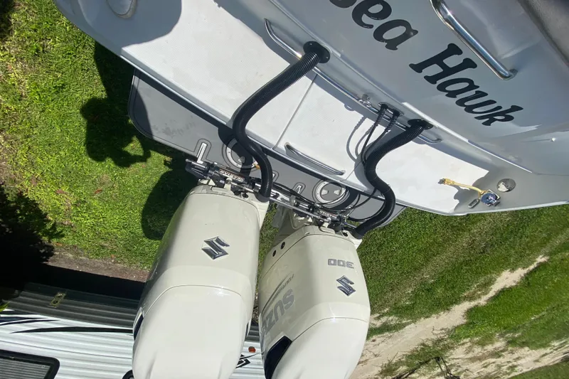 Slide: The Image of 2005 Formula 280 Sun Sport boat with dual Suzuki outboard motors, named "Sea Hawk." - 43