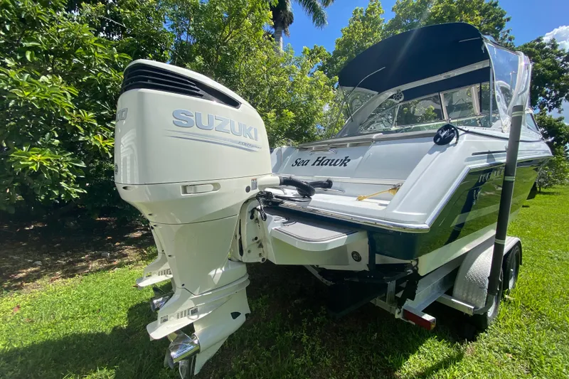 Slide: The Image of 2005 Formula 280 Sun Sport boat with Suzuki outboard motor on a trailer. - 46