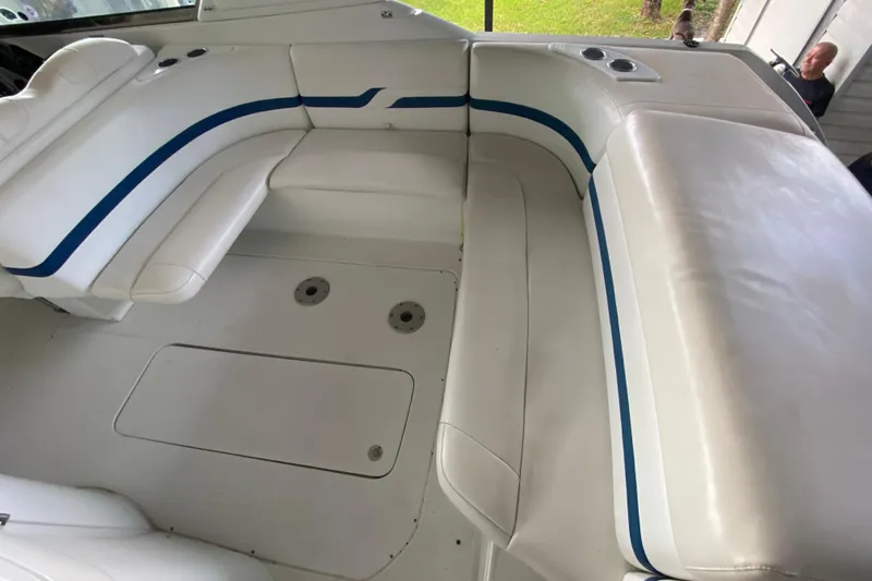 Slide: The Image of 2005 Formula 330 Sun Sport boat interior with white and blue seating. - 19