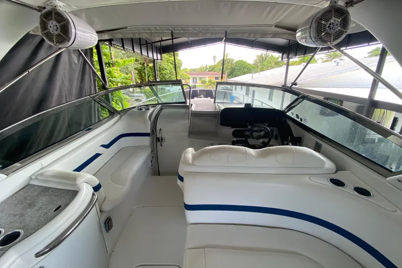 Slide: The Image of 2005 Formula 330 Sun Sport boat interior with white seating and modern dashboard. - 20