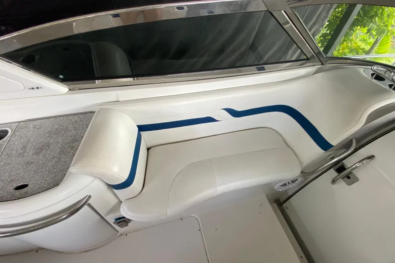 Slide: The Image of 2005 Formula 330 Sun Sport boat interior with white and blue seating. - 22