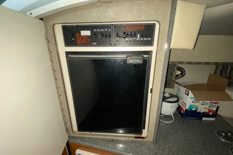 Slide: The Image of 2005 Formula 330 Sun Sport cabin with control panel and mini fridge. - 32