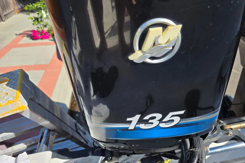 Slide: The Image of Mercury 135 outboard motor on a 2003 Boston Whaler 255 Conquest boat. - 10