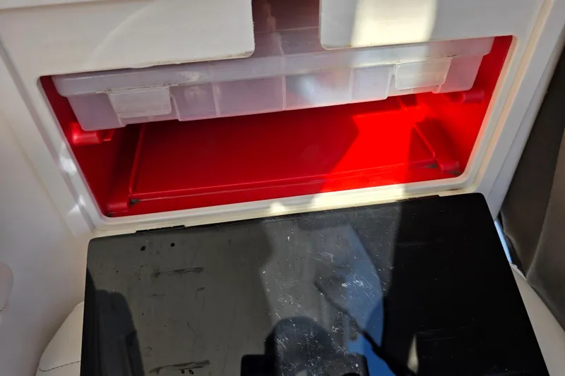 Slide: The Image of Storage compartment inside a 2003 Boston Whaler 255 Conquest boat. - 27