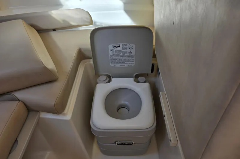 Slide: The Image of Portable toilet in 2003 Boston Whaler 255 Conquest boat cabin. - 31