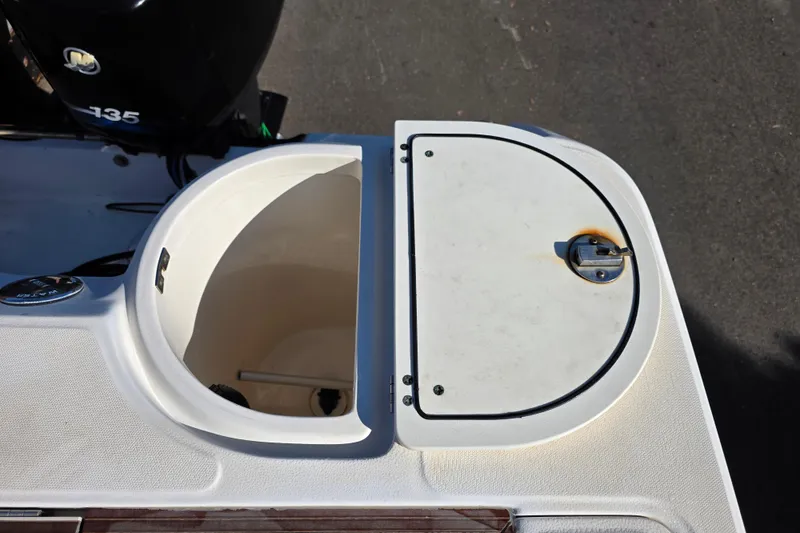 Slide: The Image of Open storage compartment on a 2003 Boston Whaler 255 Conquest boat. - 34